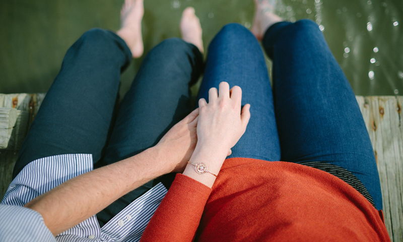 Couple on dock with bracelet. Photo Provided by Brown Goldsmiths Couple on dock with bracelet. Photo Provided by Brown Goldsmiths
