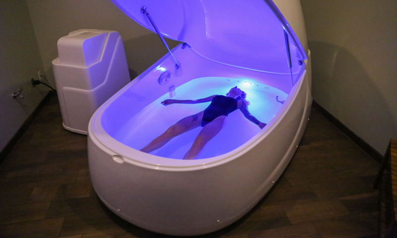Person laying in tub. Photo Provided by Float Harder Relaxation Center Person laying in tub. Photo Provided by Float Harder Relaxation Center