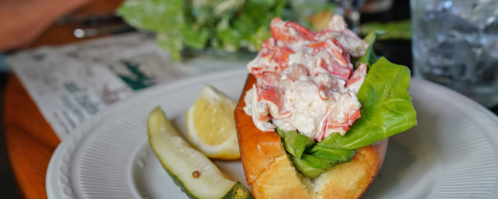 Plated Lobster Roll with Side of Pickle and Lemon, Photo Courtesy of Kirsten Alana / GLP Films Lobster Roll, Photo Courtesy of GLP Films