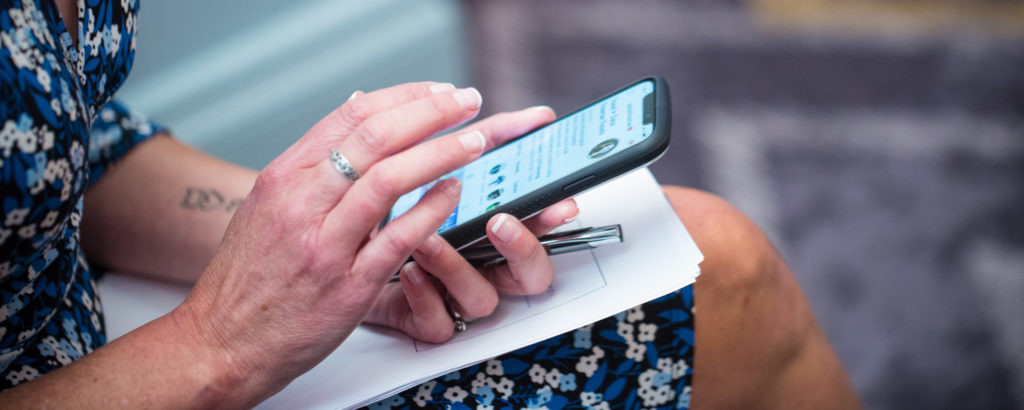 Woman Scrolling on Phone, Photo Credit: Focus Photography Woman Scrolling on Phone, Photo Credit: Focus Photography