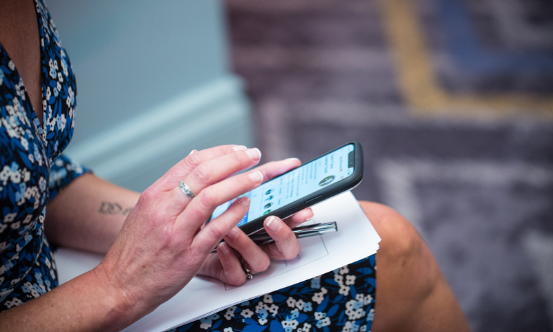 Woman Scrolling on Phone, Photo Credit: Focus Photography Woman Scrolling on Phone, Photo Credit: Focus Photography