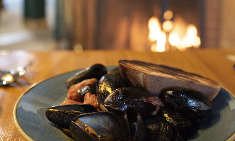 Broad Arrow Tavern Mussels near Fireplace, Photo Credits: Capshore Photography Broad Arrow Tavern Mussels near Fireplace, Photo Credits: Capshore Photography