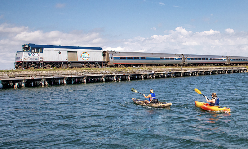 Amtrak Downeaster Passing Kayakers. Photo Courtesy of NNEPRA Amtrak Downeaster Passing Kayakers. Photo Courtesy of NNEPRA