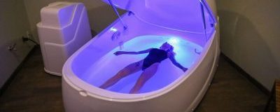 Person laying in tub. Photo Provided by Float Harder Relaxation Center Person laying in tub. Photo Provided by Float Harder Relaxation Center