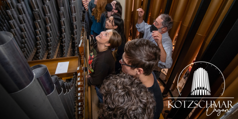 Friends of the Kotzschmar Organ; Photo courtesy of Friends of the Kotzschmar Organ Group standing and listening to organ