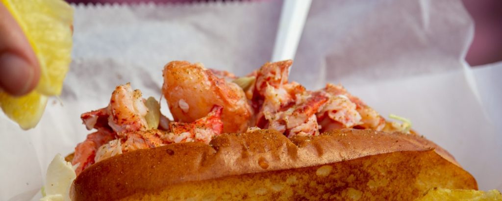Bite into Maine Lobster rolls, Photo Credits: Serena Folding Bite into Maine Lobster rolls, Photo Credits: Serena Folding