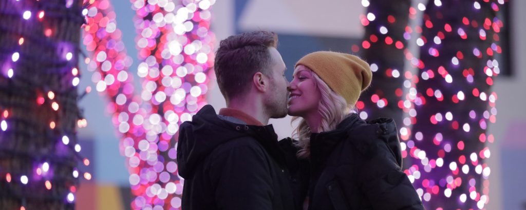 Couple in front of Pandora Christmas lights, Photo Credit: Knack Factory Couple in front of Pandora Christmas lights, Photo Credit: Knack Factory