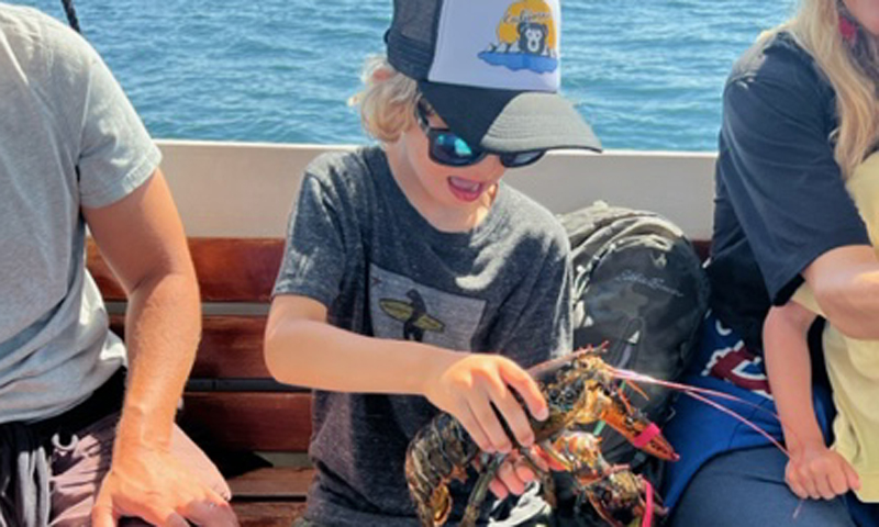 Kid with Lobster. Photo Provided by Rugosa Lobster Tours Kid with Lobster. Photo Provided by Rugosa Lobster Tours