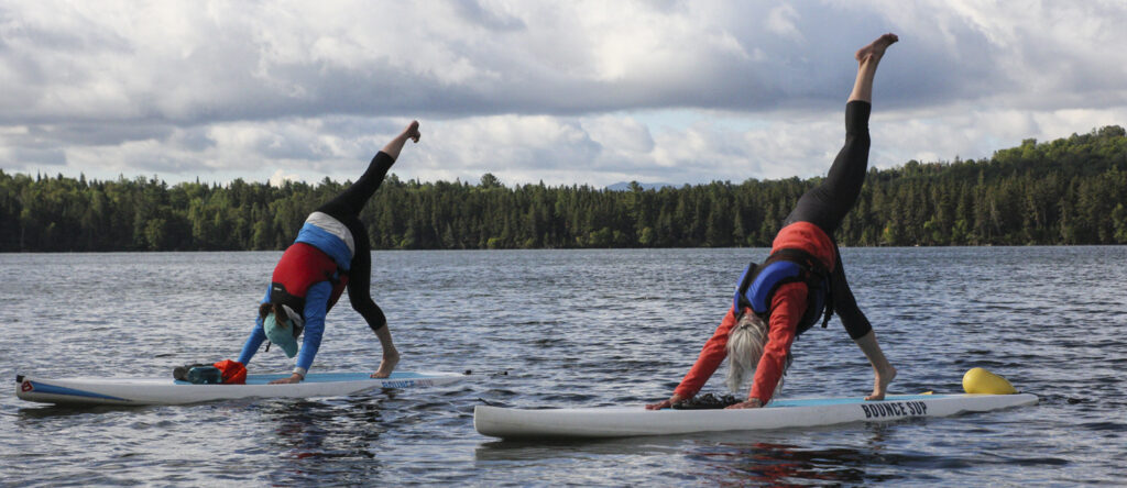 Stand up paddle boarding yoga, Photo Credit: P.J. Schwarz Stand up paddle boarding yoga, Photo Credit: P.J. Schwarz