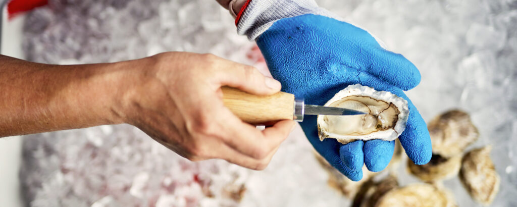 Oyster Shucking. Photo credit: Lone Spruce Creative, courtesy of Maine Office of Tourism Oyster Shucking. Photo credit: Lone Spruce Creative, courtesy of Maine Office of Tourism