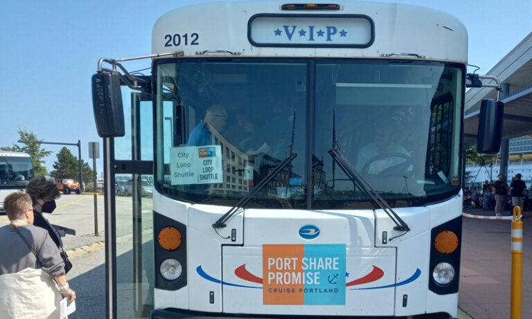 People boarding a white city loop shuttle bus; Photo Credit: Richard Leeman People boarding a white city loop shuttle bus; Photo Credit: Richard Leeman